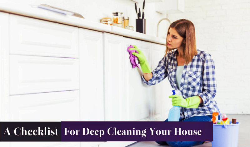 beautiful woman wiping kitchen cabinets