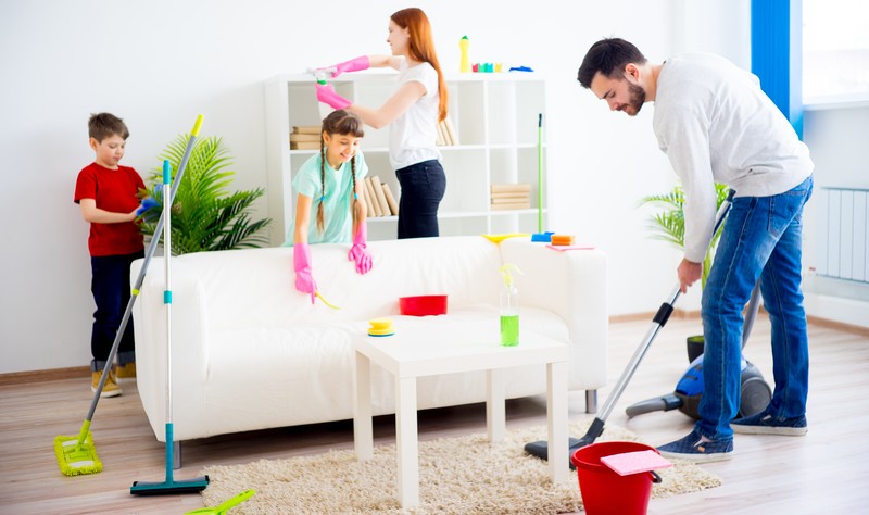 entire family is busy in making their living space tidy