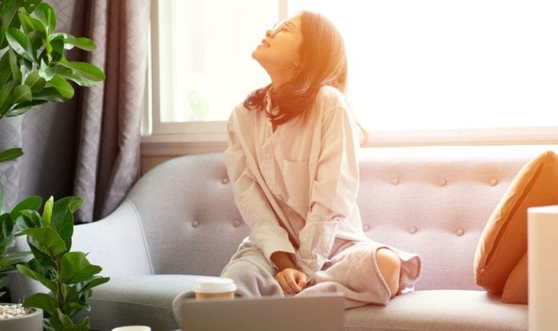 Young woman sitting on a couch