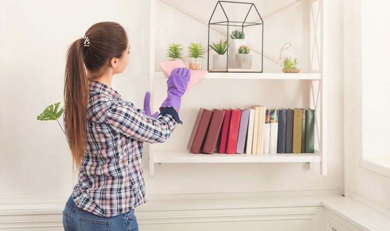 Young woman sprucing up her house
