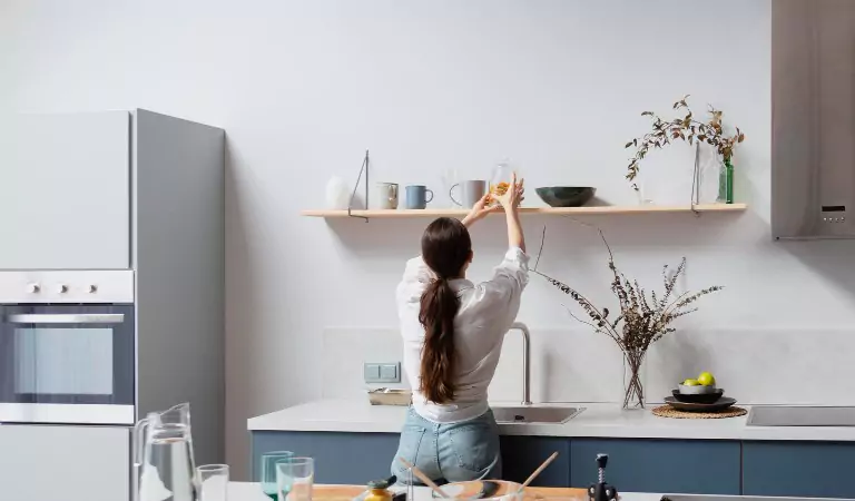 woman organising a kitchen