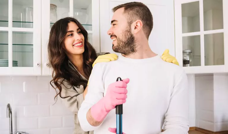 couple inside of a house ready to clean