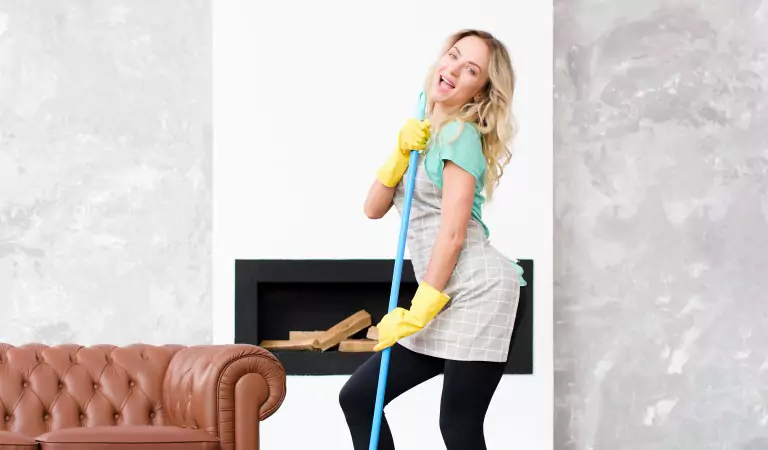 young woman looking happy and ready to clean