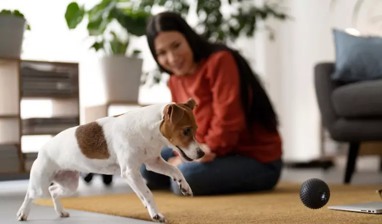 woman with her dog inside of her house