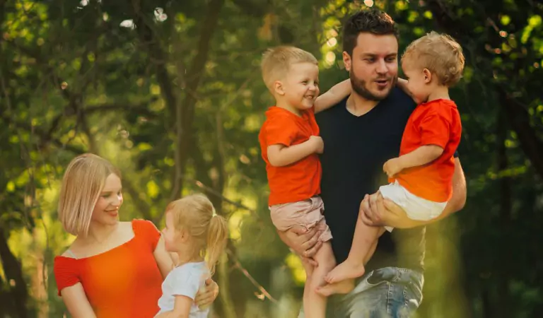 entire family enjoying outside of their house