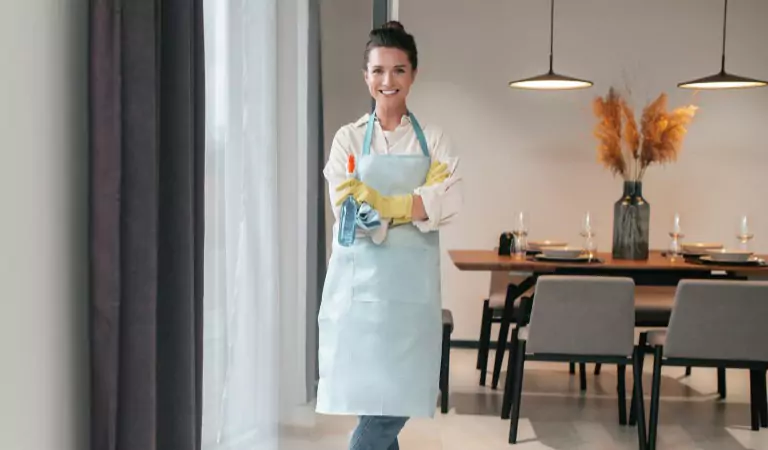 woman inside of a house ready to clean