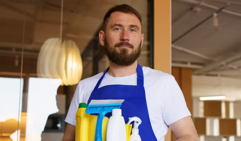young man with some cleaning products