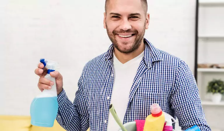 young man with some cleaning products