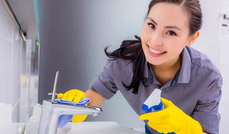 woman cleaning her bathroom