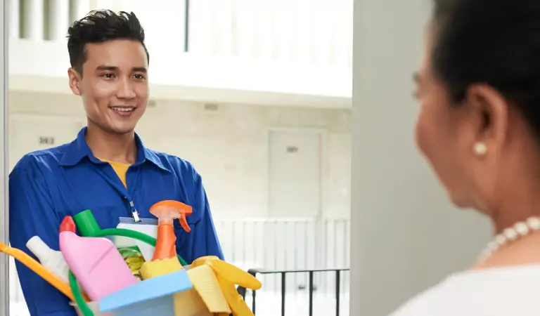 professional cleaner with some cleaning supplies