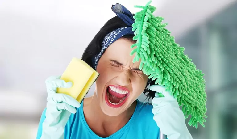 young woman looking stressed about cleaning