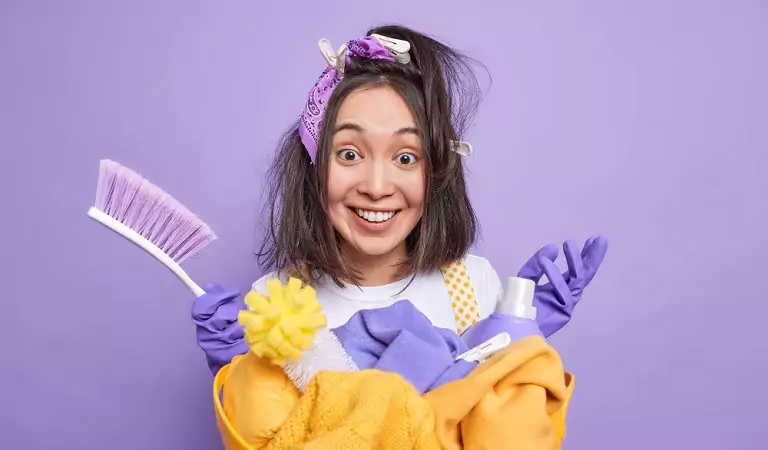 woman with some cleaning supplies