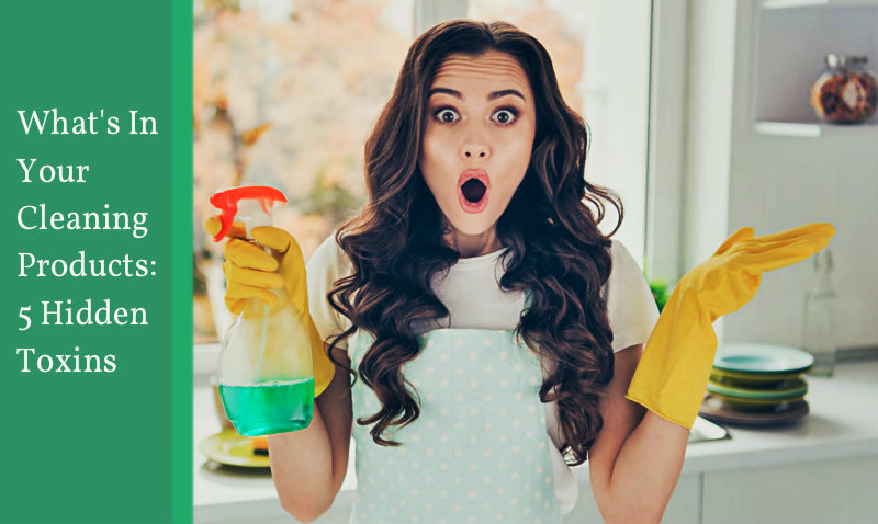 beautiful young woman amused and holding spray bottle in hand
