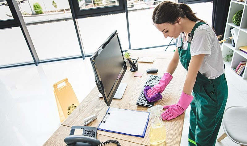 Young professional is sprucing up a workplace