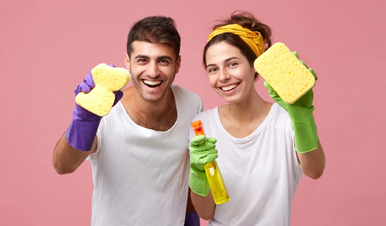Housekeeping, cleanliness, hygiene and domestic work concept. happy caucasian young family in protective rubber gloves